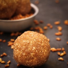 Rice Ladoo / Ari Unda - Kerala snack made of parboiled rice palm sugar and coconut, selective focus