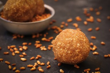 Rice Ladoo / Ari Unda - Kerala snack made of parboiled rice palm sugar and coconut, selective focus