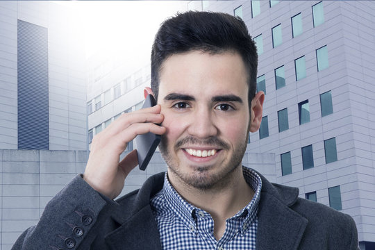 businessman smiling talking on mobile phone