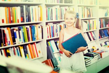 Girl holding chosen book