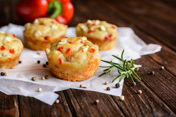 Savory muffins with Feta cheese, curd, pepper and herbs