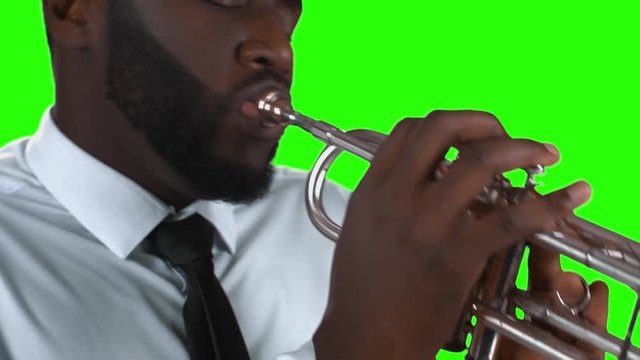 Trumpeter on green background. Afro-american musician. Best jazz hits.