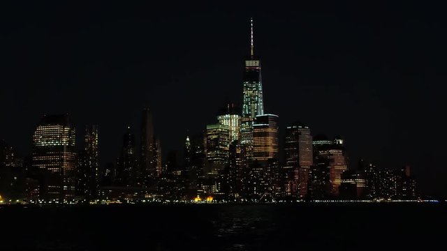 Cruising on the Hudson River by night observing magical New York City skyline