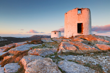 Windmills over  Chora of Amorgos island early in the morning.