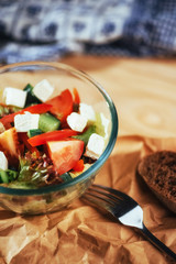 Greek salad with fresh vegetables, feta cheese and olives