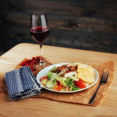 Caesar salad with croutons, quail eggs, cherry tomatoes and gril
