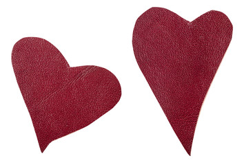 two red leather hearts isolated