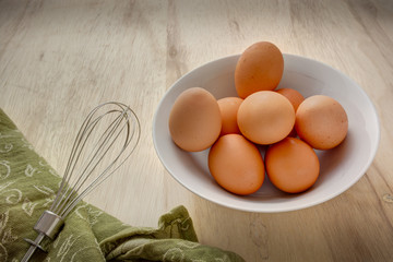 Eggs in a bowl with whisk