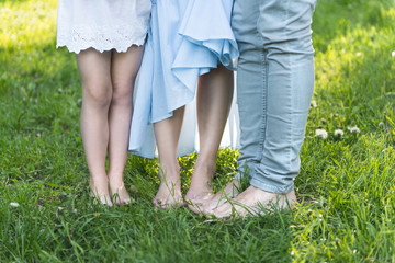 feet of couple, legs of family outdoor
