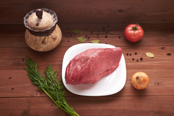 piece of meat on a wooden table