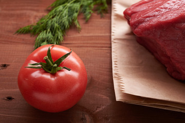 piece of meat on a wooden table