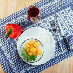 Fried cheese balls with salad and sauce