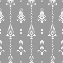 Fototapeta na wymiar Bohemian seamless vector pattern. White on gray tileable navajo background.