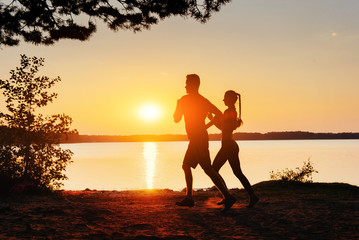 Fototapeta premium couple on the bike at sunset. Carpathian, Ukraine, Europe