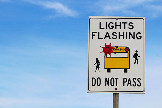 Closeup of a Light Flashing Do Not Pass Sign