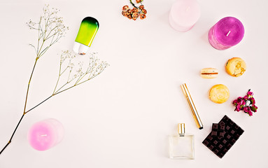 Woman's make up cosmetics and perfumes on white background