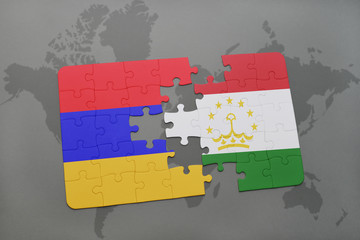 puzzle with the national flag of armenia and tajikistan on a world map