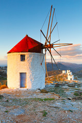 Windmills over  Chora of Amorgos island early in the morning.