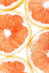 background with citrus fruit of grapefruit slices.