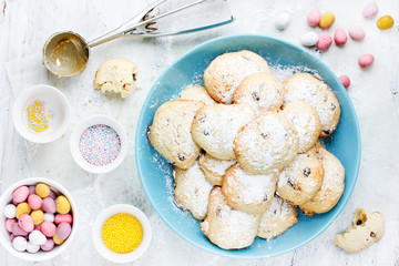 Delicious Easter cookies with chocolate candy eggs and colorful sugar sprinkles