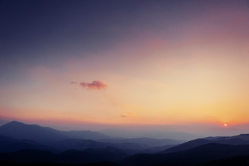 colorful sky with sun background in mountains. sunset, sunrise