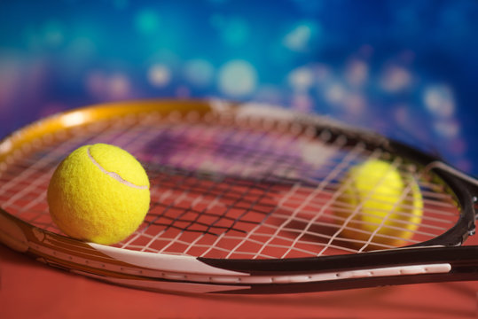 Tennis Balls and Racket on a  Outdoor Court