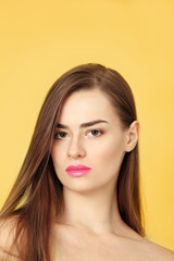 Portrait of beautiful young woman on color background