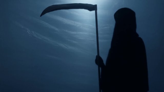 Terrible shadow of Grim Reaper with scythe turning to camera, risk of death