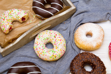 Colorful donuts with chocolate and icing, selective focus