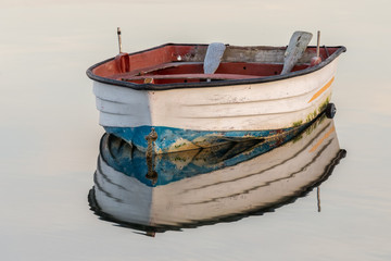 wooden fishing boat on a background of water