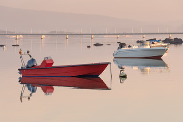 wooden fishing boat on a background of water