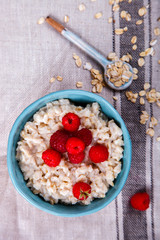Oatmeal Porridge with fresh Berries,Raspberry.Breakfast.Concept of Healthy Eating. Copy space.selective focus.