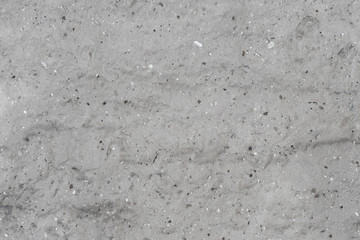 Plastered walls of abandoned building, seen scattered small stones, textures
