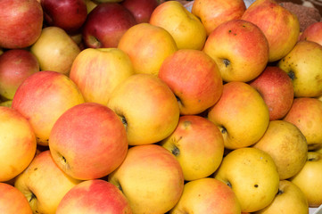 A bunch of yellow and green apples on the table in the market, Novi Sad, Serbia