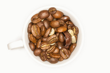 Close Up Of A White Coffee Cup Full Of Coffee Beans