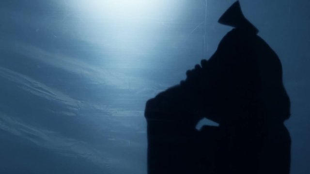 Cruel executioner shadow killing victim with axe, carrying out death sentence