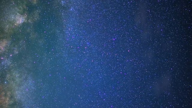 Astrophotography Time Lapse of Milky Way Galaxy Rising through Clouds -Ver/Pan-