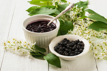 Medicinal plant bird cherry (flowering branches, dried berries and jam)