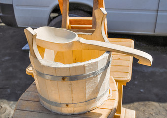 Trade of Handicrafts in the street in the spring. Oak tub and ladle for sauna