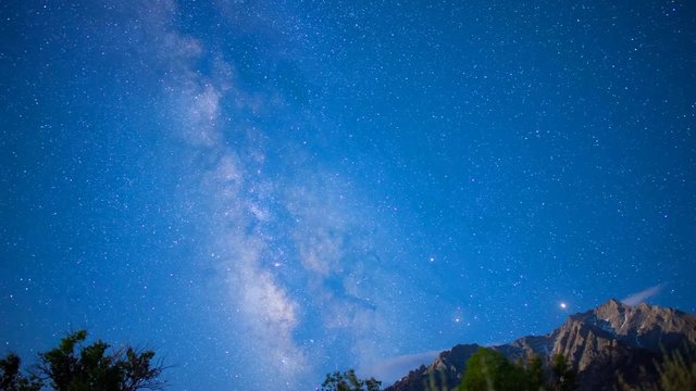 Astro Time Lapse of Milky Way Fading over Sierra Nevada Mtns -Tilt Up-