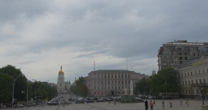 the Picturesque View on Saint Sophia Bell Tower, the Ministry of Foreigh Affairs, the Monument to Saint Olga, and a Lot of Pedestrians on the Square
