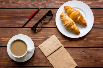 Business breakfast with coffee and croussant top view