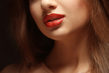 Portrait of beautiful young woman with professional makeup, close up