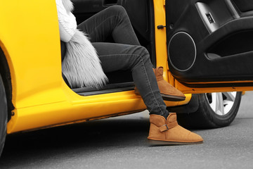 Woman sitting in yellow taxi