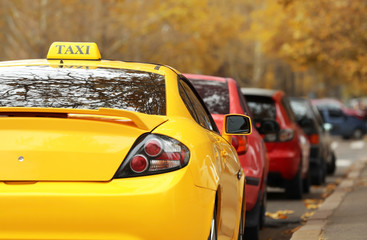 Closeup of yellow taxi cab in traffic jam