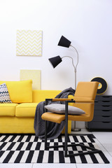 Modern living room interior with yellow sofa