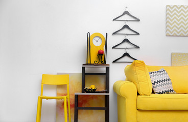 Modern living room interior with yellow sofa