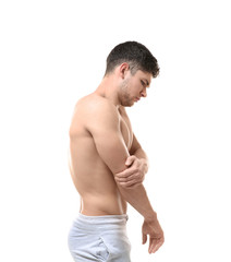 Obraz premium Young man suffering from pain in elbow on white background