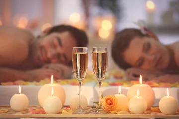 Poster Beautiful spa composition with glasses and happy couple on background © Africa Studio