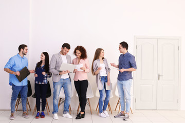 Group of people waiting for job interview in office hall